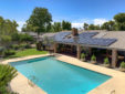 Inviting Pool with Residential Solar Install Above On Home