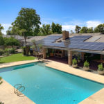 Inviting Pool with Residential Solar Install Above On Home