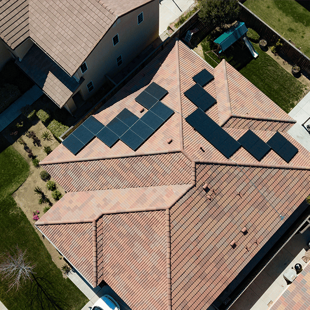 Arial views of rooftop solar panels and surrounding area of back yards.