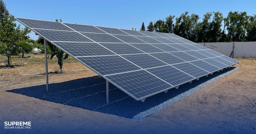 Yes, We Install Ground Mounted Solar Panels - A side view of a ground mounted solar panel in an agricultural field.