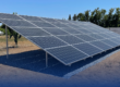 Yes, We Install Ground Mounted Solar Panels - A side view of a ground mounted solar panel in an agricultural field.