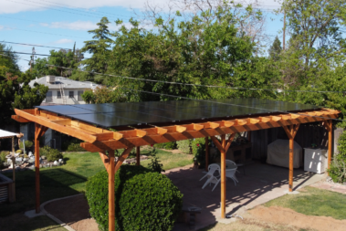 Solar patio cover shown in a back yard