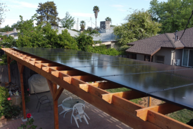 side view of solar patio cover in back yard