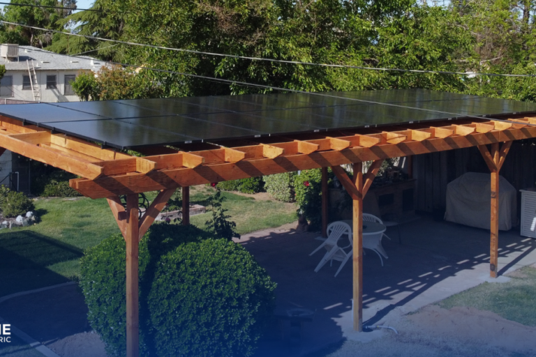 Why are all your neighbors getting solar patio covers? A pergola patio in a back yard has solar panels on top.