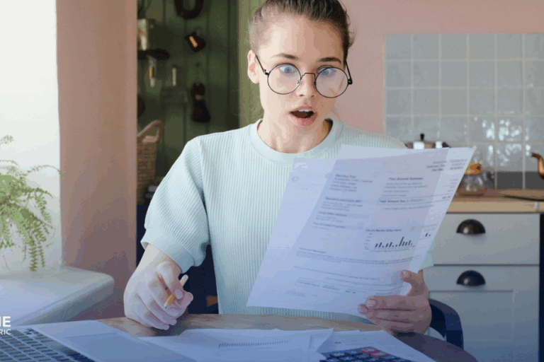 Fresno Has Highest Electric Bills in the Nation: How Solar Can Help Reduce Your Costs. Amazed woman looks at her electric bill.